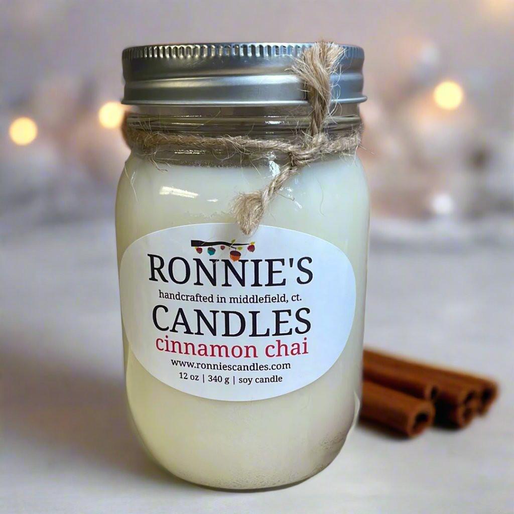 Cozy cinnamon chai clean burning candles creating warm and inviting ambiance
