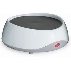 Elegant candle warmer enhancing ambiance while safely melting scented candles for a soothing aromatic experience.