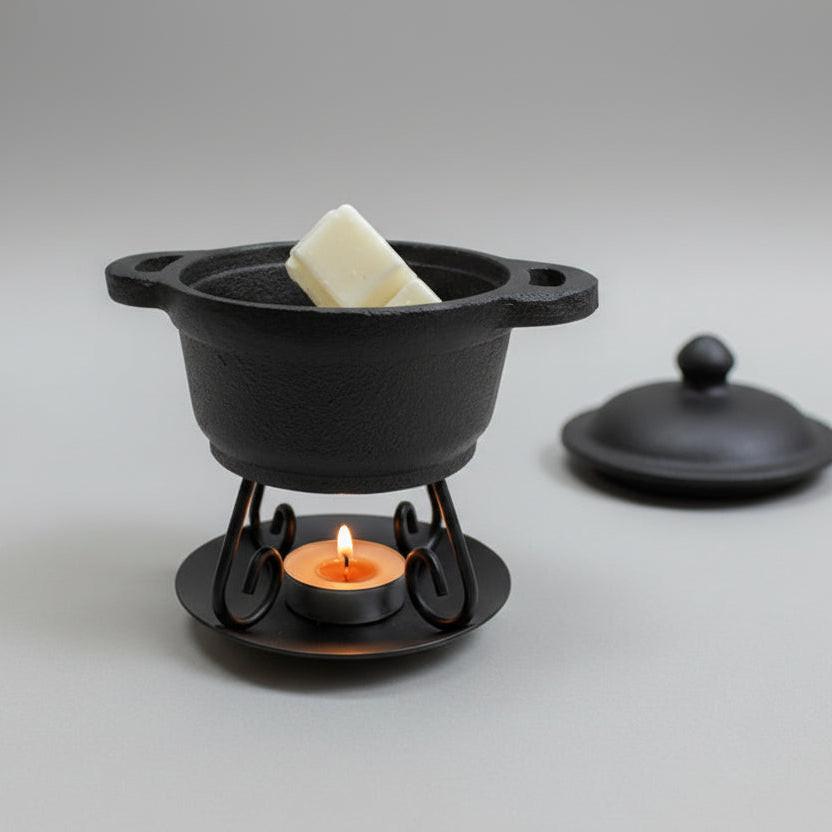 Cast iron Dutch oven used as a wax warmer for efficient and stylish home fragrance solutions