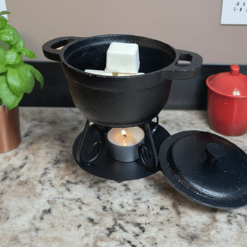 Cast iron Dutch oven used as a wax warmer for efficient and stylish home fragrance solutions