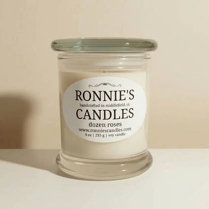 Dozen roses with soy candle emitting strong floral fragrance for elegant home ambiance