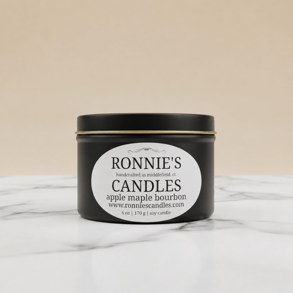 Hand crafted soy candle in a black tin with apple and maple scents for a strong aromatic fragrance.