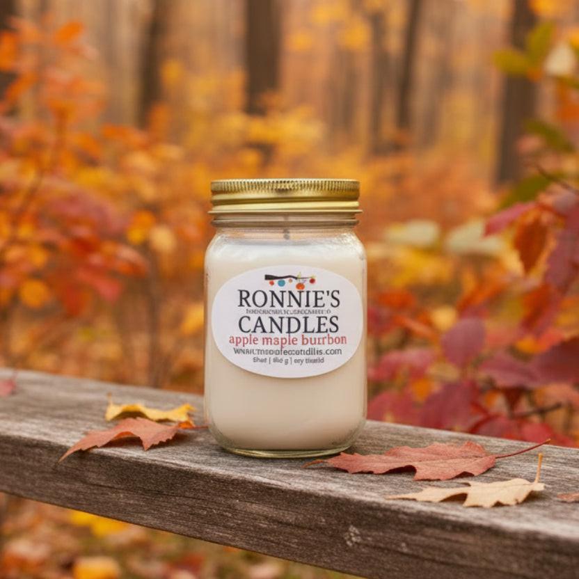 Hand crafted soy candle in a mason jar with apple and maple scents for a autumn aromatic experience.