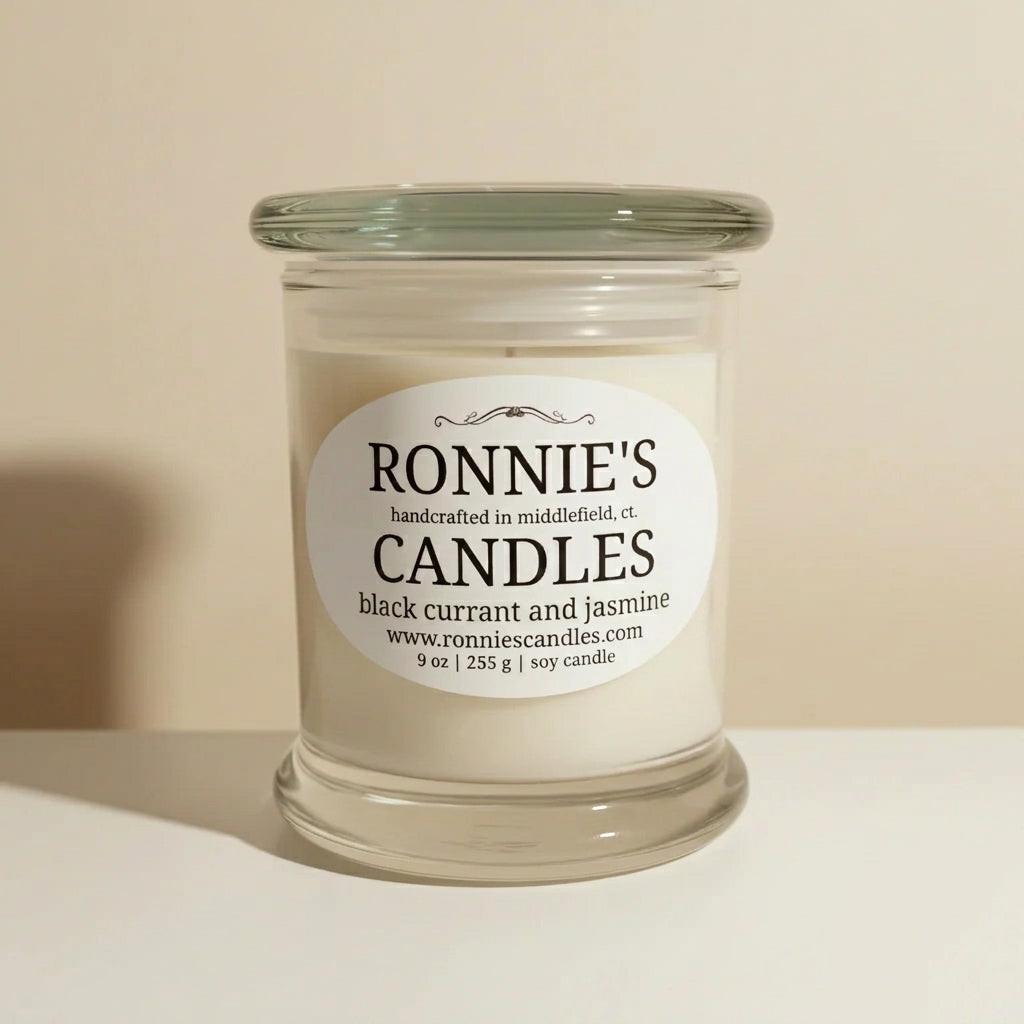 Black Currant and Jasmine scented soy wax candle in an elegant container, perfect for aromatherapy and home decoration