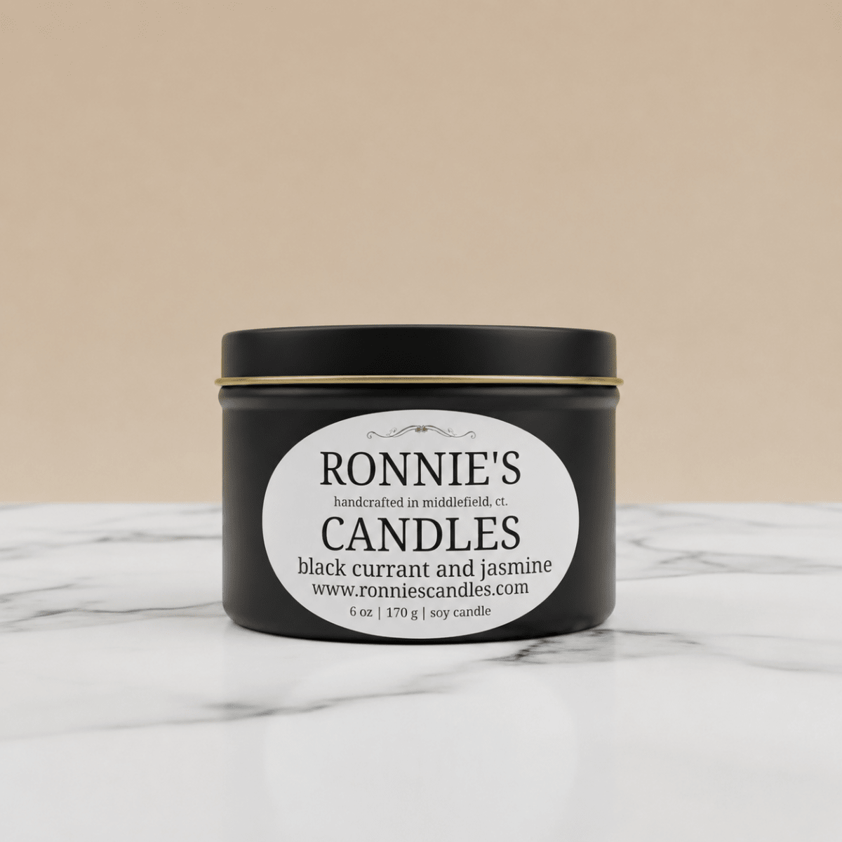 Black Currant and Jasmine scented soy wax candle in an elegant container, perfect for aromatherapy and home decoration