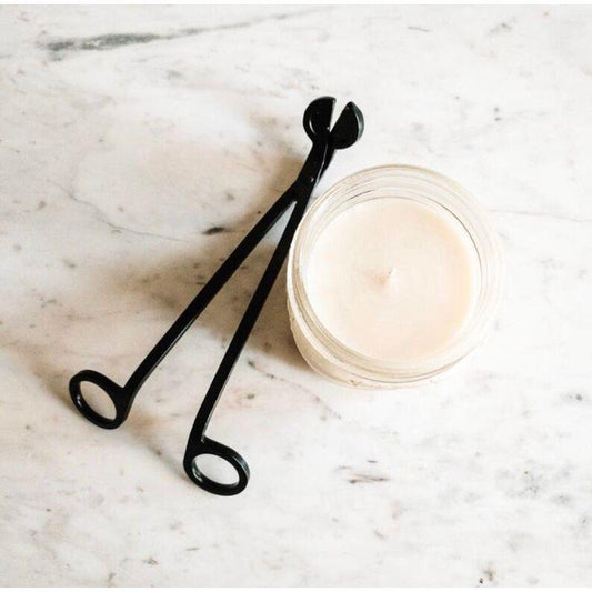Wick trimmer tool used to cut candle wick and remove carbon buildup for cleaner burns