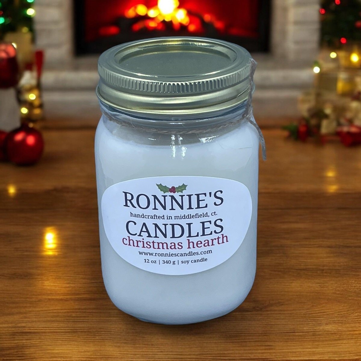Elegant Christmas candle flickering by a luxurious fireplace, filling the air with rich holiday scented candle aromas.