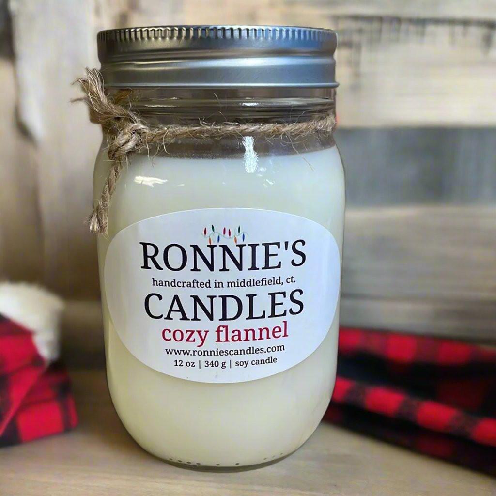 Cozy flannel soy candle with clean scent, perfect for a warm and inviting home atmosphere