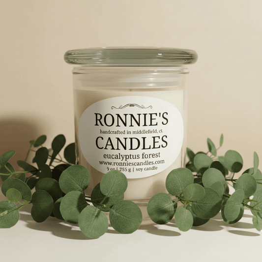 Eucalyptus soy candle emitting a soothing aroma, inspired by the tranquility of the forest environment.