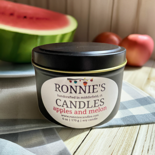 Soy candle emitting strong scent of fresh apples and juicy melon, perfect for aromatic home ambiance