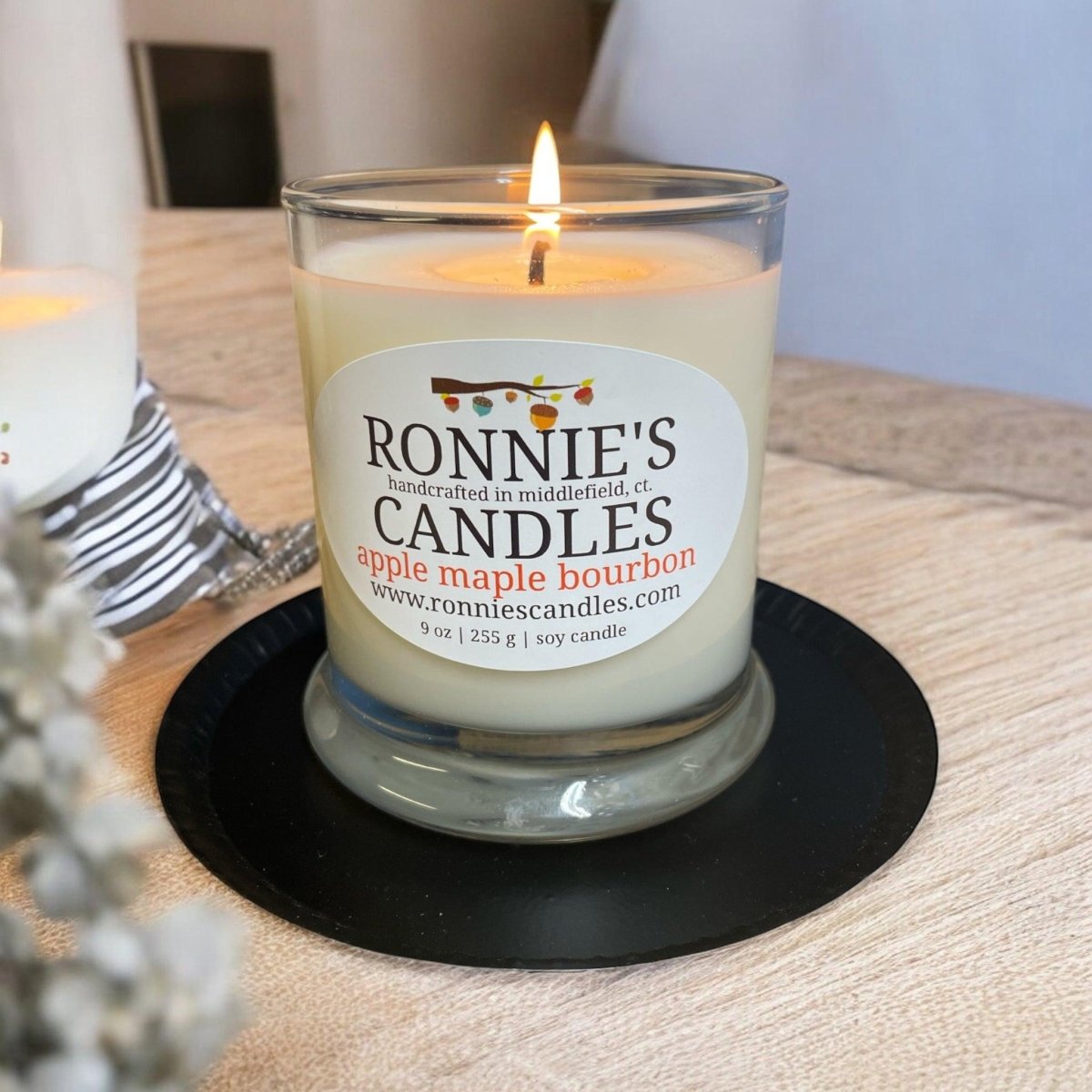 Metal candle coaster designed for added safety and protection of surfaces
