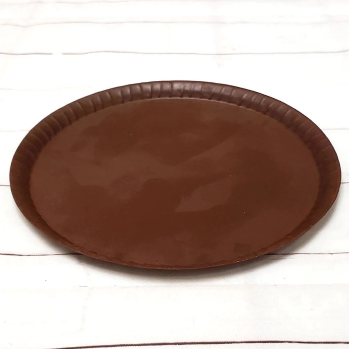 Metal candle coaster designed for added safety and protection of surfaces