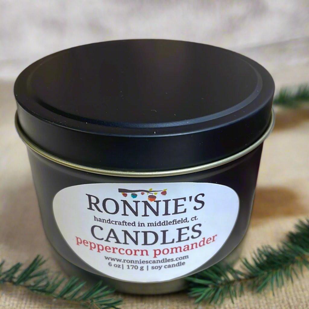 Scented soy candle with orange pomander notes, perfect for a cozy and fresh ambiance