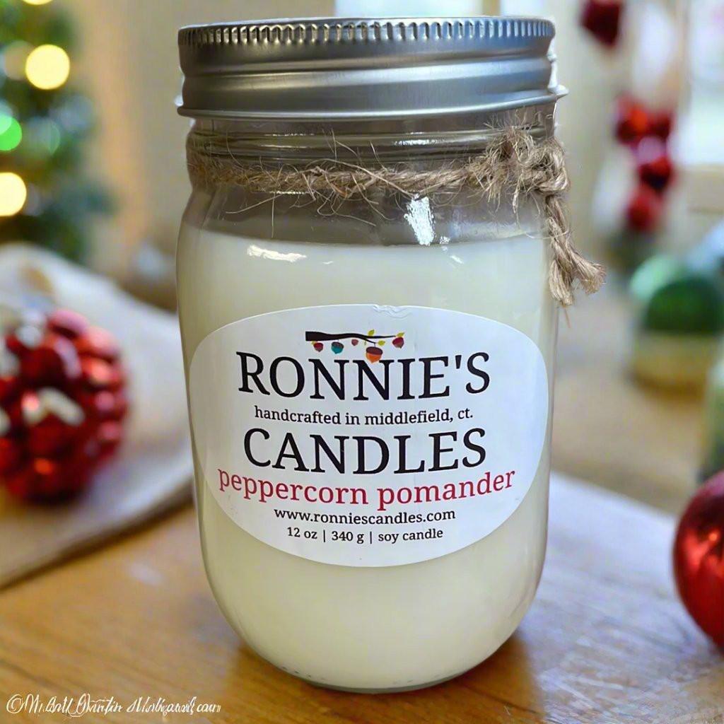 Scented soy candle with orange pomander notes, perfect for a cozy and fresh ambiance