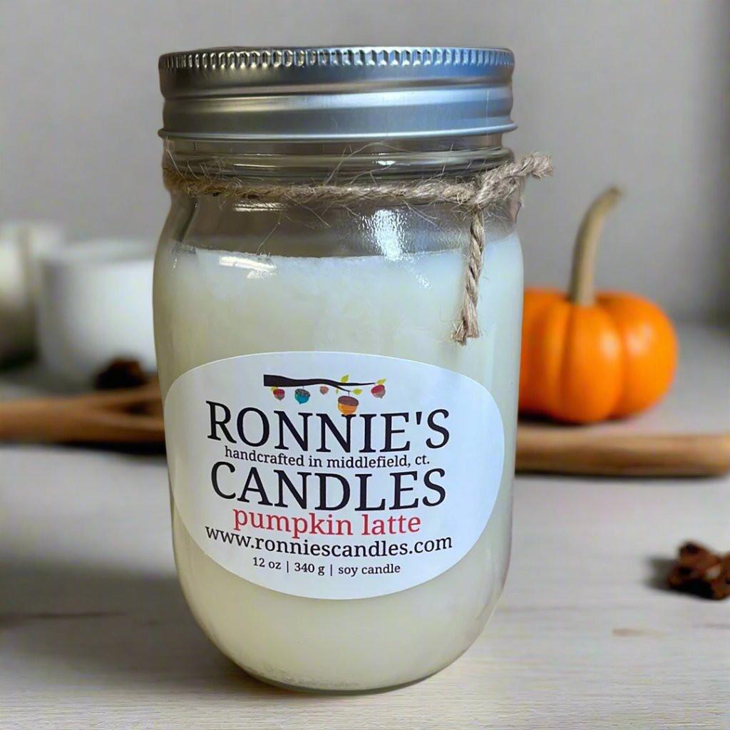 Cozy autumn candle with pumpkin latte scent, perfect for fall vibes and warm, inviting home fragrance