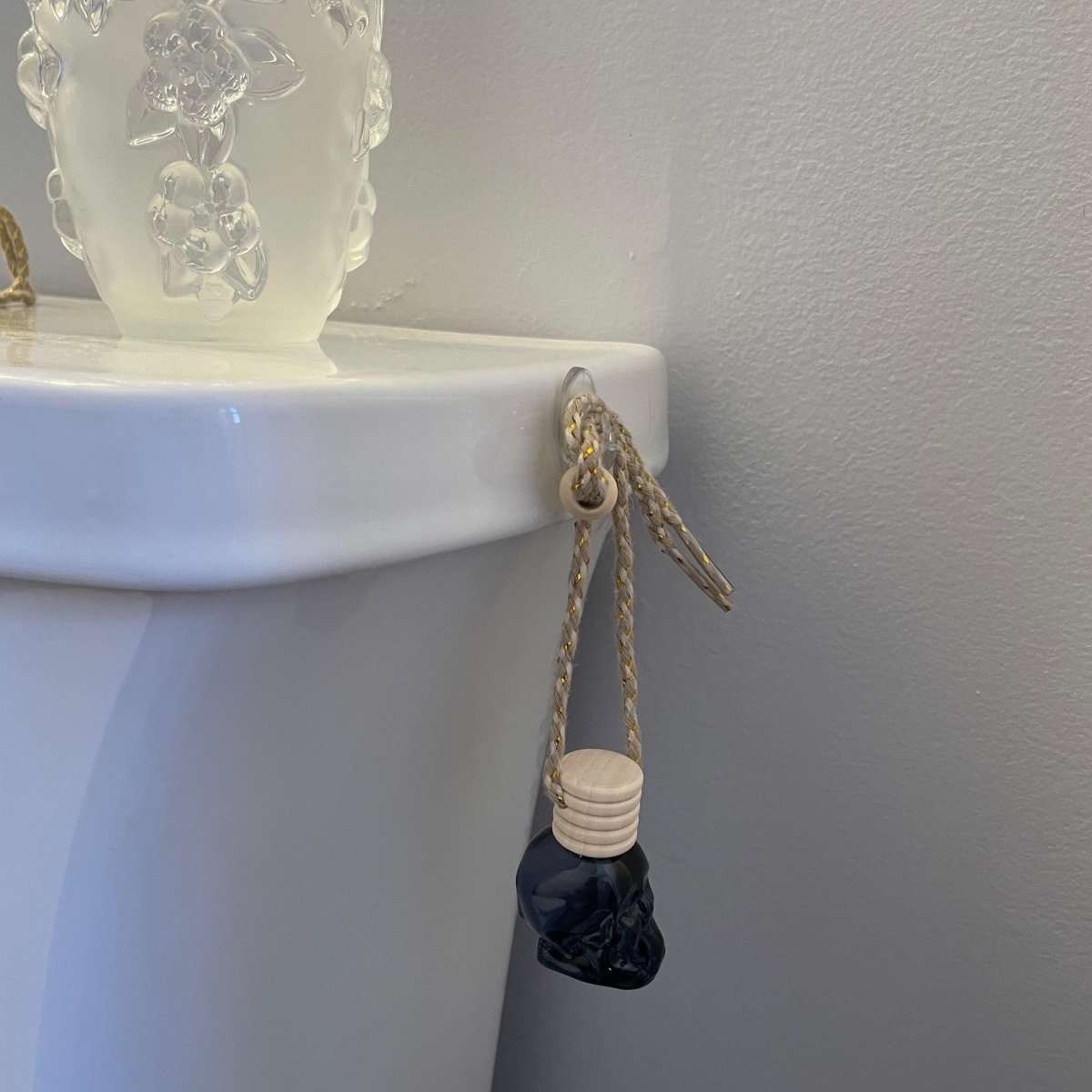 Toilet tank charms fragrance dispenser designed to freshen bathrooms with long-lasting scent and elegant appeal