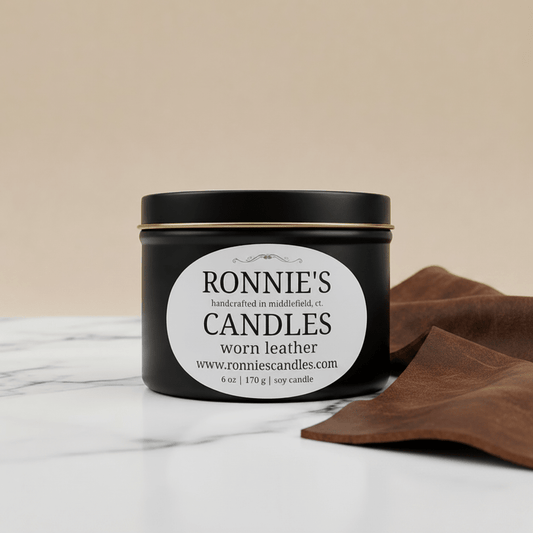 Worn leather soy candle with earthy scents, perfect leather scented candle for cozy ambiance